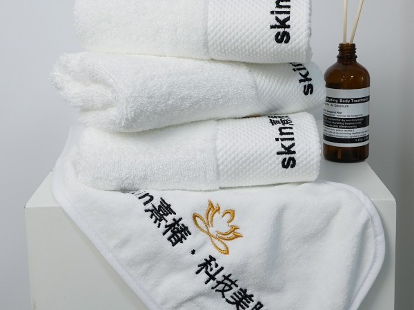 Pure cotton white towel with platinum segment embroidery in the beauty salon