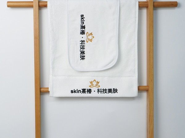Pure cotton white towel with platinum segment embroidery in the beauty salon