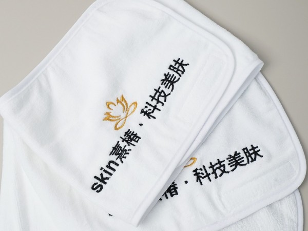 Pure cotton white towel with platinum segment embroidery in the beauty salon