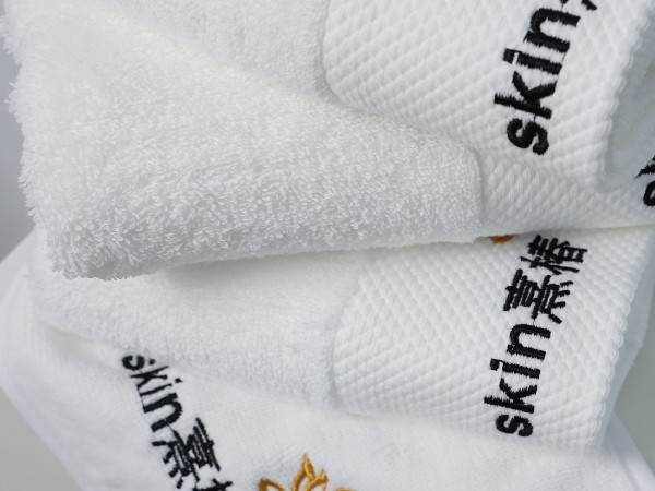 Pure cotton white towel with platinum segment embroidery in the beauty salon