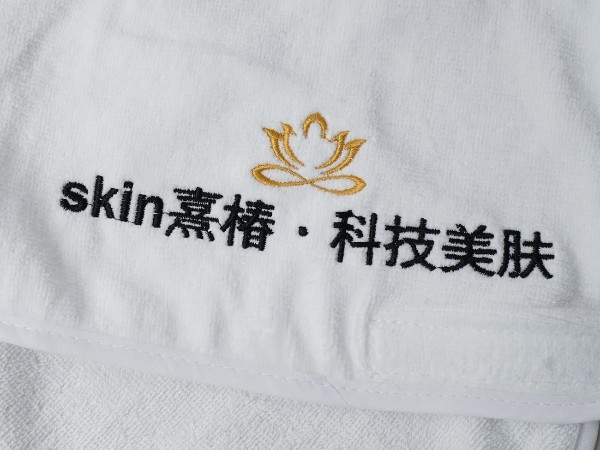 Pure cotton white towel with platinum segment embroidery in the beauty salon