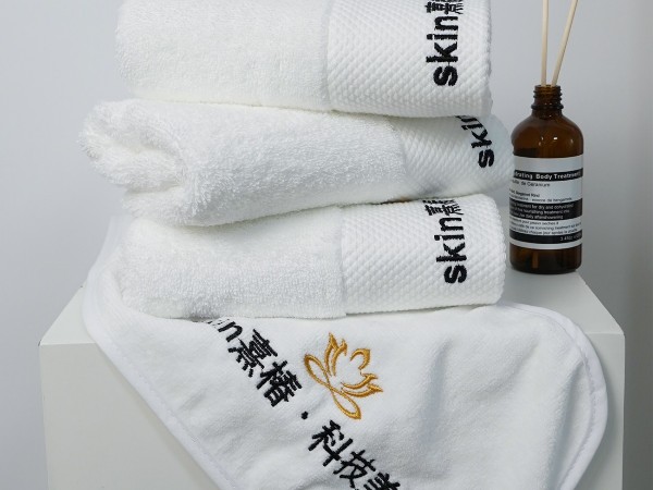 Pure cotton white towel with platinum segment embroidery in the beauty salon